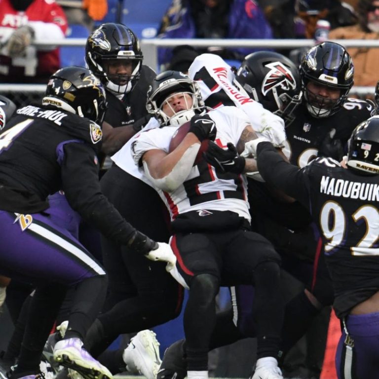 Ravens lock up playoff berth as defense stifles Falcons