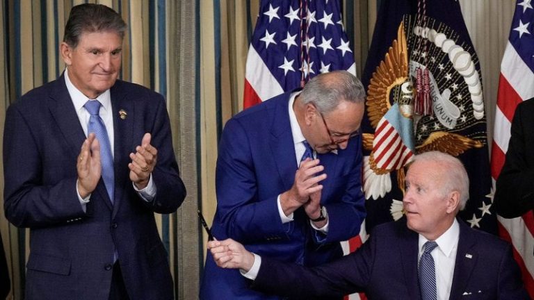 Biden backs adding Manchin’s energy bill to defense legislation despite progressive opposition