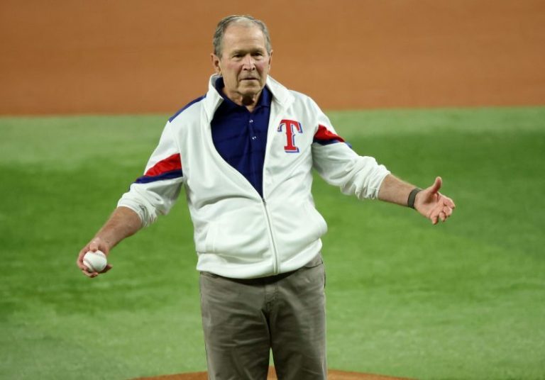George W. Bush seen with gold mustang chain at SMU basketball game