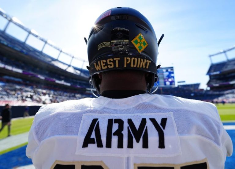 Army football player, father rescue man from burning car